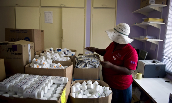 A health worker manages supplies in a PEPFAR-funded AIDS clinic in Johannesburg, South Africa, on January 27, 2012