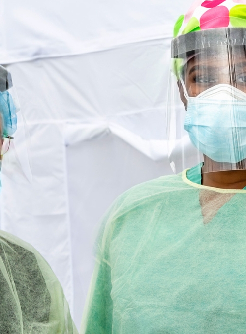 Frontline Epidemic Medical providers in Protective Gear Caring for Patients. By Pixel Prose Images